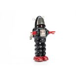 A Yoshiya (K.O) Japan Tinplate Clockwork Planet Robot, Robby the Robot type, black tin body, red