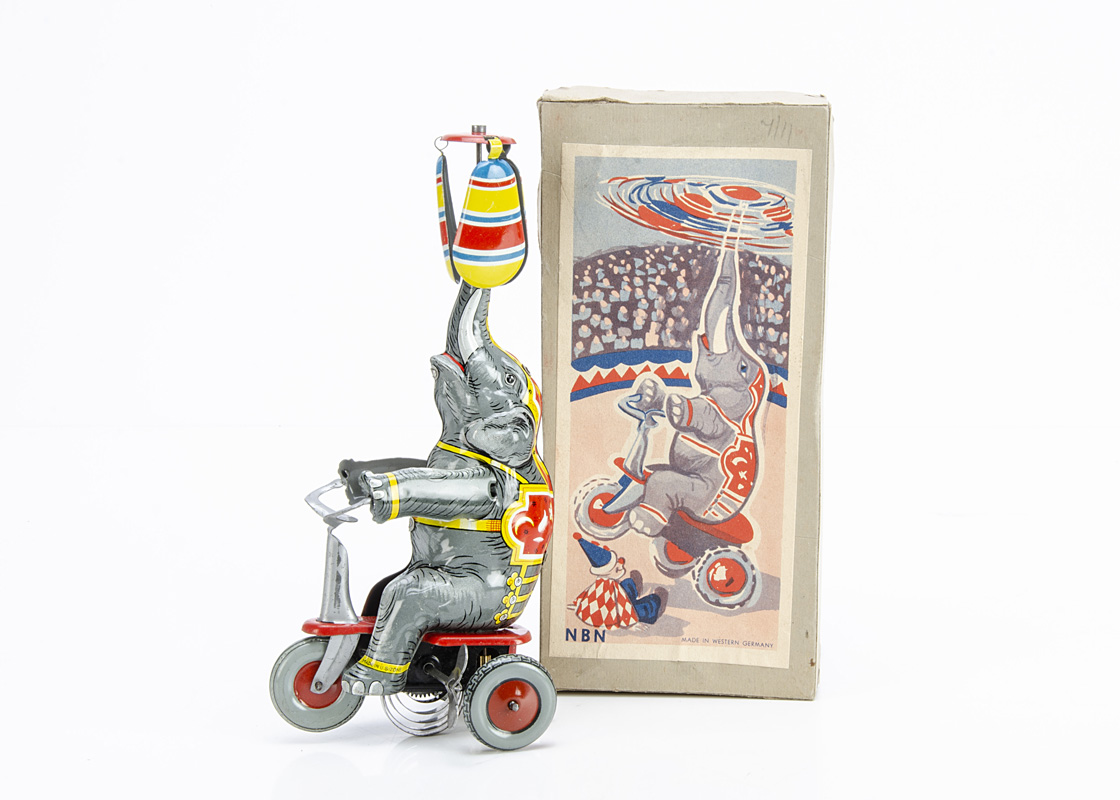 A NBN Tinplate Clockwork Circus Elephant On Tricycle, 1950s detailed tinprinted toy with fixed key