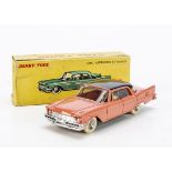 A French Dinky Toys 545 De Soto Diplomat, salmon pink body, black roof, concave hubs, in original