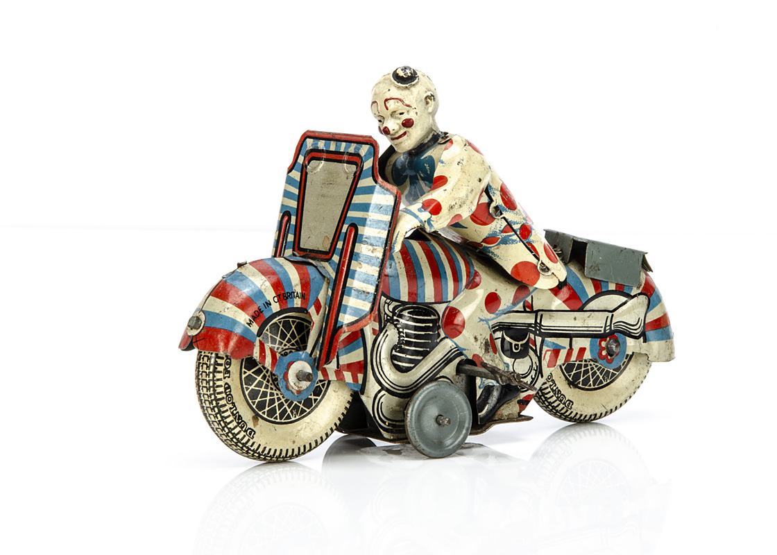 A Mettoy Tinplate Clockwork Clown Motorcycle, detailed tinprinted motorcycle with Clown rider, '