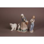 Three modern Lladro porcelain figures, one of a young girl with duck and ducklings, 23.5cm, a