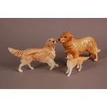 Three pottery models of golden retriever doggies, with an example by Sylvas, Royal Doulton and