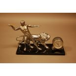 An Art Deco Period French chromed and black marble figural clock, having athletic spear throwing man