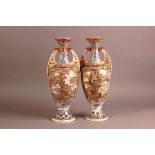 A pair of first half 20th century Japanese Satsuma style earthenware vase, 45cm, one with chip to