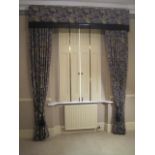 A modern set of blue and cream curtains and accessories, with pelmet and cord and tassel tie