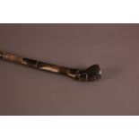 An early 20th century African horn walking cane, 96cm, the terminal with stylised head on shaft of