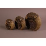 A modern stoneware family of three abstract elephants by Govinder Nazran, largest 22.5cm, limited
