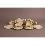 An Art Deco British pottery tete a tete tea set, probably Newport Pottery by Clarice Cliff, some