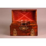 A Victorian rosewood tea caddy from Austin Westmoreland St Dublin, 31cm wide, domed lid with brass