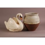 A mid 20th century Dartmouth pottery model of a swan, 28cm high, some small chips, together with a