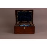 A Victorian rosewood travel dressing table box, 30cm wide, with contents and mop panel to lid