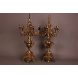 A pair of mid 20th century brass candelabra, 69cm, five branches with central scone and snuffer (4)