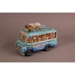 A modern ceramic comical sculpture of a tourist bus by Guillermo Forchin, 31cm long, chipped, titled