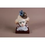 A Lladro porcelain figure of a sad clowns head, 26.5cm, professionally restored to one of the petals