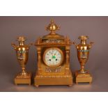 A late 19th century French gilt and champleve clock and garniture, 38cm, having pretty enamel dial