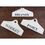 Three named porcelain bin labels, WHISKEY, PORT and BRANDY, whiskey and port rounded coat hanger