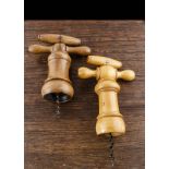 Two large boxwood turned barrel corkscrews, one with mechanism a little stiff, 19cm to worm, 27cm