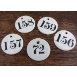Fifteen porcelain bin numbers, 29, 40, 45, 60, 64, 65, 70,71, 72, 90, 101, 156, 157, 158 and 159,