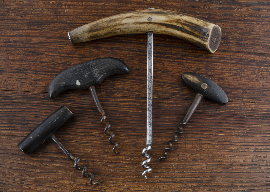 Nine French 20th Century direct pull corkscrews, two brass mounted horn handles, a large stag handle