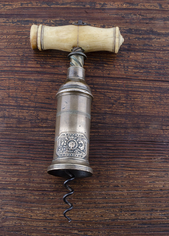 An English 19th Century Thomason type double action corkscrew, turned bone handle with hanging