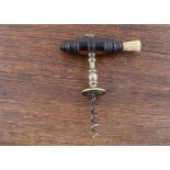 An English 19th Century Henshall type corkscrew, brass shank with an integral brass incised