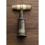 An English 19th Century Thomason type double action corkscrew, ribbed and barrel shaped bone