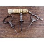 Three English 19th Century corkscrews, one Henshall type with bone handle and brush decorated