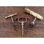 Three English 19th Century corkscrews, one Henshall type with bone handle and brush, pear drop steel