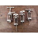 Four French 20th Century all steel mechanical corkscrews, a flip top corkscrew made by Perille, 'A