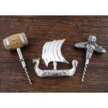 Seven Scandinavian 20th Century direct pull figural corkscrews, a pewter Bacchus pressing grapes,