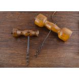 Two English late 19th Century 'Codd' corkscrews, both boxwood handles, one with two bulbous ends,