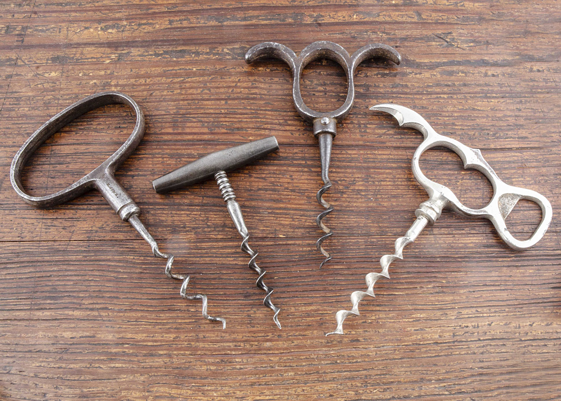 Nine metal direct pull corkscrews, including a cellarman marked 'R Jones', a Lund worm marked '