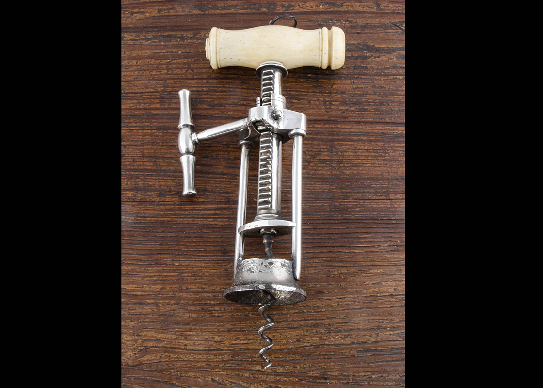 An English plated 19th Century two column narrow rack and pinion corkscrew with bone handle and