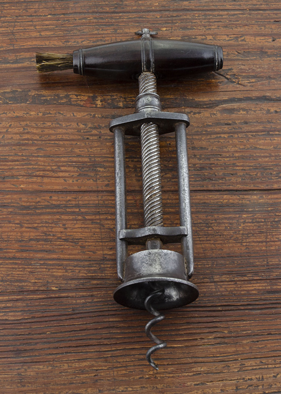 An English 19th Century steel two pillar corkscrew, fine threaded shaft, with barrel shape