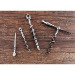 Three 19th Century English steel peg and worm corkscrews, largest 7.6cm to worm, 11cm closed