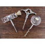 Three Scandinavian direct pull figural corkscrews, two glass handles made by a Swedish glass