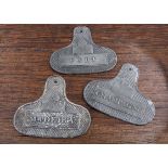 A rare/seldom seen set of three named Zinc bin labels, Port, Madeira and Champagne, rounded shoulder