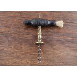 An English 19th Century Henshall type corkscrew, brass shank with an integral brass incised