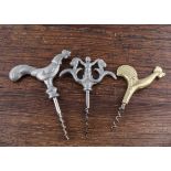 Seven Scandinavian 20th Century direct pull figural corkscrews, a pewter cock, a brass chicken, a