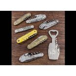 A selection of thirteen French assorted combination pocket knives with corkscrews, bottle shape