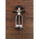 A late 19th Century German nickel plated flynut corkscrew, marked on one side of the steel frame, '