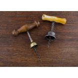 Two self puller 'bells' corkscrews, an American Williams Bennit brass bell marked 'Pat May 15th