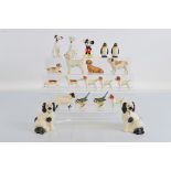 A collection of Beswick porcelain animal figures, including dogs, birds, sheep. Together with