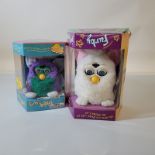 Two boxed Tiger Electronic Furbies, One Furby Babies and one Furby