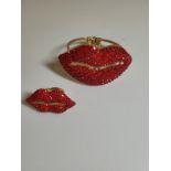 A Butler & Wilson Lips bangle and ring set, red gem encrusted, with box.