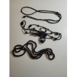 A Butler & Wilson jet style beaded necklace, 53cm long. Together with two similar examples (3)