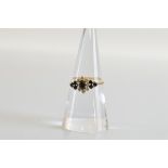 A 9ct gold sapphire and diamond cluster ring, ring size O. 2g