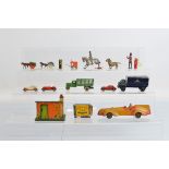 A small group of unboxed vintage British diecast models, including two carts and three cars by