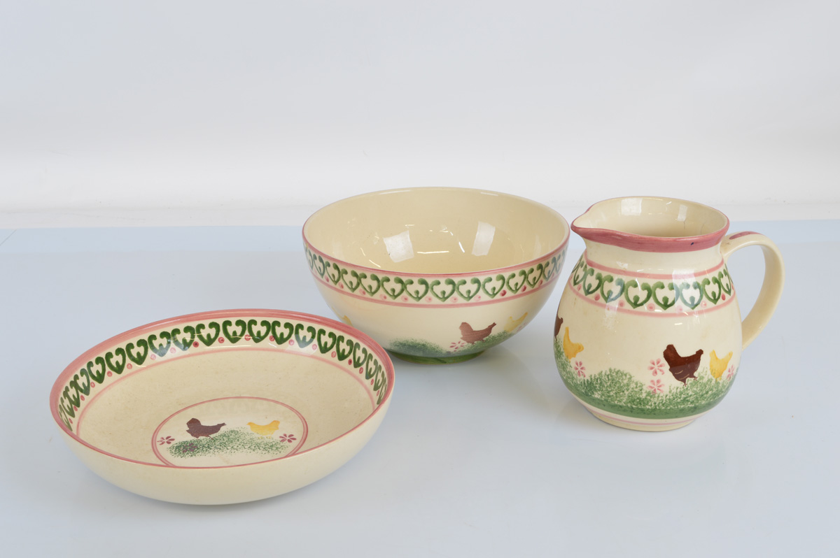 A hand painted ceramic jug, basin and bowl set, painted with Chicken and Hen scenes