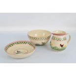 A hand painted ceramic jug, basin and bowl set, painted with Chicken and Hen scenes
